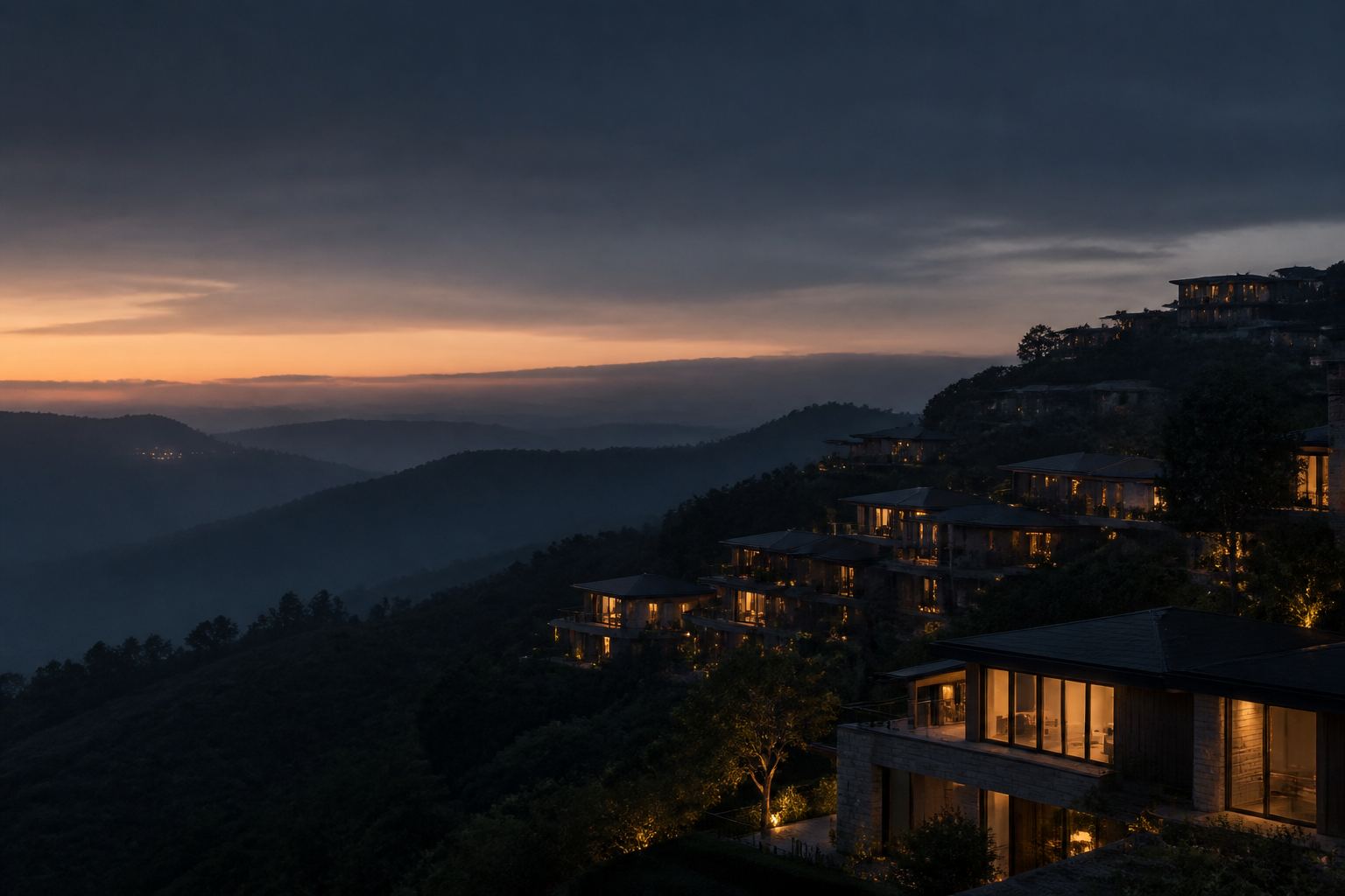 Modern hillside homes illuminated at dusk